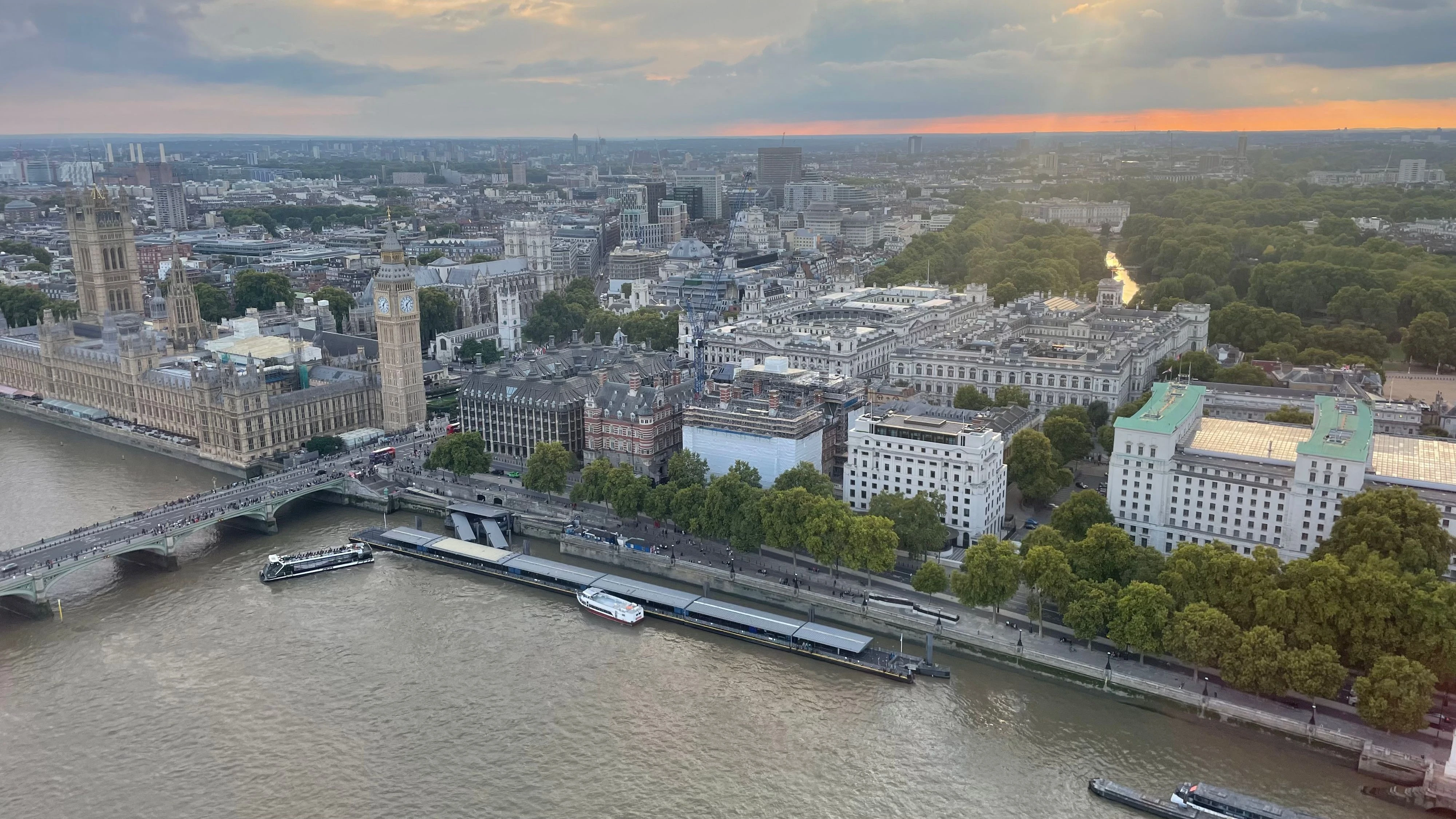 A panoramic view of Westminster and the Thames at sunset